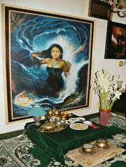 The picture of Nyai Loro Kidul  with downcast eyes, a billowing, green ocean all around her