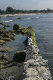 Part of the Japanese dock ruins and fish market on the background