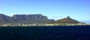 The whole panorama is dominated by Table Mountain towering above the city of Cape Town