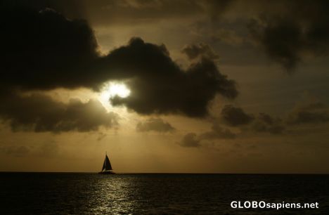 Postcard Arubian sunset with a boat