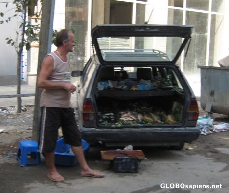Postcard Selling fresh fishes in the boot of the car.