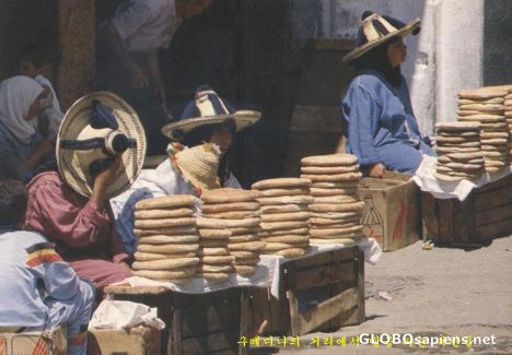 Postcard Ladies saling bread