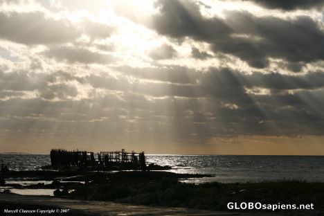 Postcard Afternoon clouds blocking out the sun over the sea