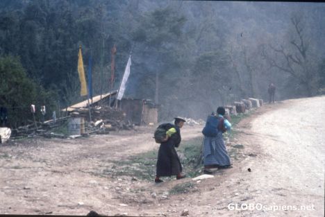 Postcard Women with heavy Load