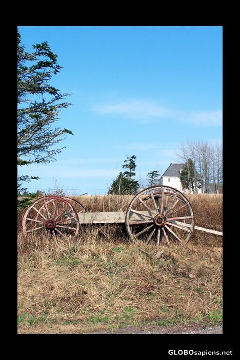 Postcard Farming implement by a farm