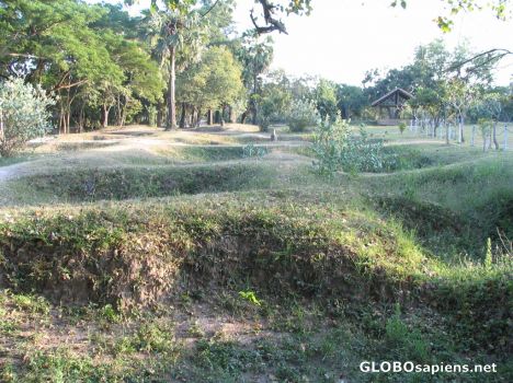 Postcard The killing Field and its many mass graves.