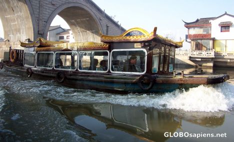 Postcard Tour boat plowing water