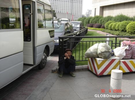 Postcard Poor man waiting for transport