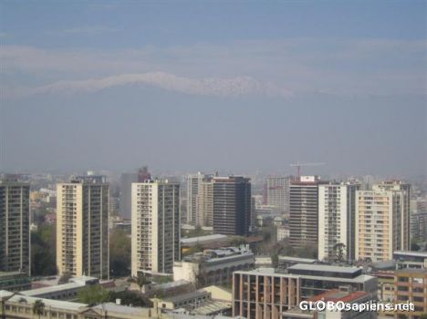 Postcard Santiago de Chile with snow mountains in the back