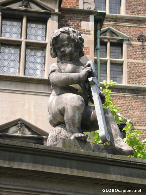 Postcard statuette on a gate