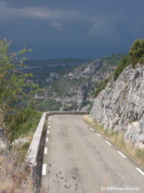 Postcard road into storm