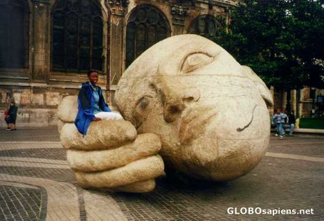Postcard A sculptured head outside