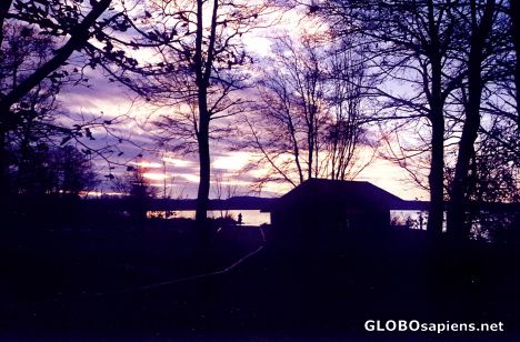 Postcard Sun Setting over Boathouse