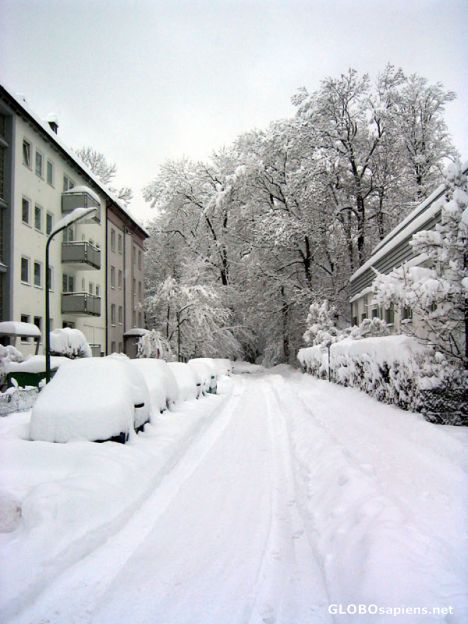Postcard A walk in the snow towards munich isar river