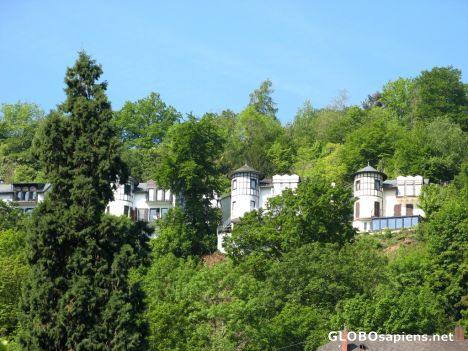 Postcard row of the same houses above the hills