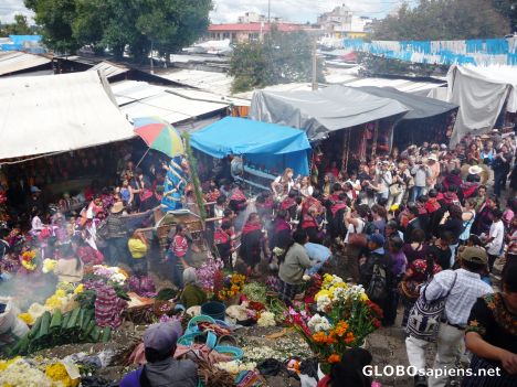 Postcard Procession pushes through the Mercado