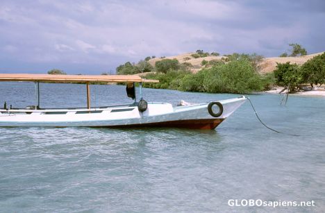 Postcard Boat at a tropical beach