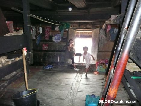 Postcard Inside the longhouse (Sumatra)
