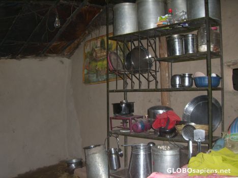 Postcard Inside a village home (storage/kitchen or living?)