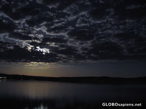 Postcard clouds keep the moon:)