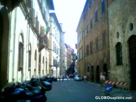 Postcard A typical street in Siena...