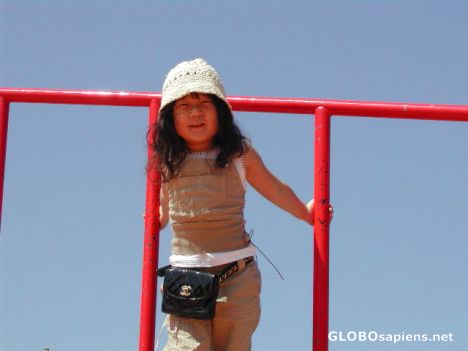 Postcard stylish kid in Ohori park playground