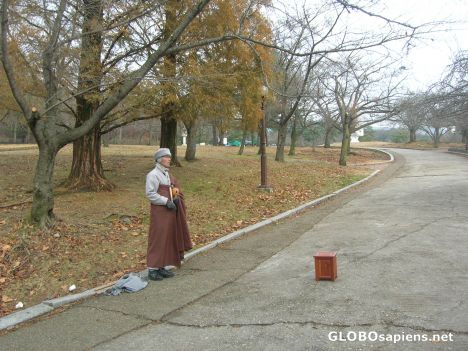 Postcard Monk waiting for alms