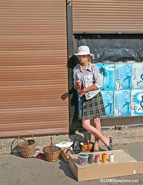 Postcard Girl selling I-don't-know-what