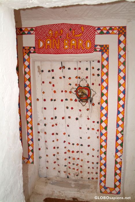 Postcard Ghadames - a door to a cafe