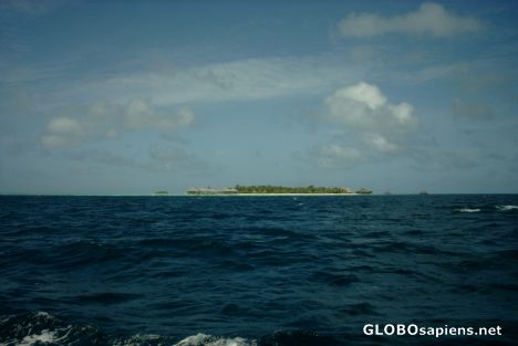 Postcard Malediven small island with water bungalows
