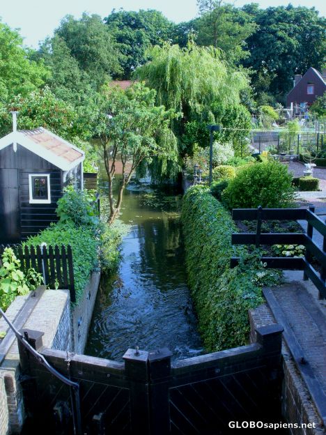 Postcard Tiny canal with floodgate