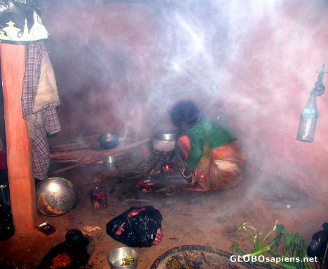 Postcard A mother is cooking food.