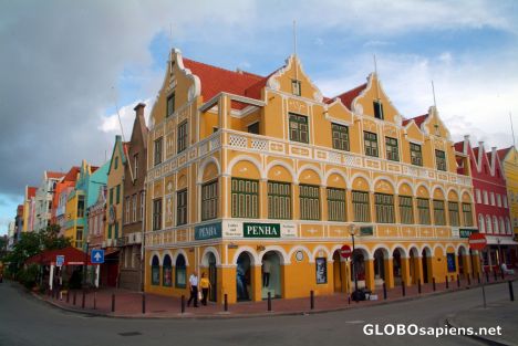 Postcard Willemstad (AN) - a yellow building