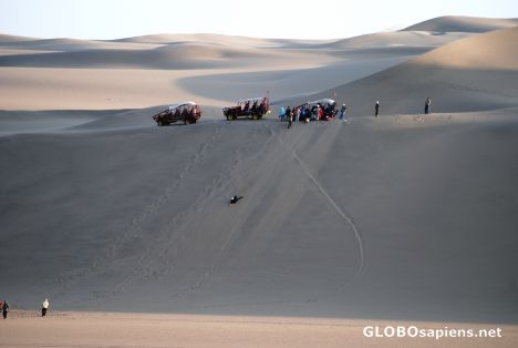 Postcard huacachina sandboarding madness