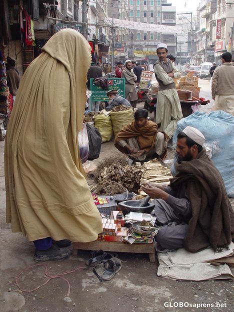 Postcard Woman buying over the old silk route.