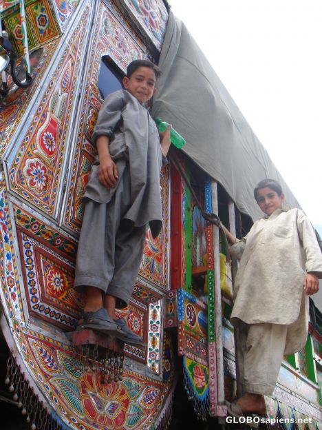 Postcard Boys posing on a beautiful decorated truck