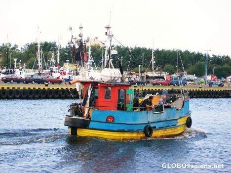 Postcard Fishing boat leaving harbor
