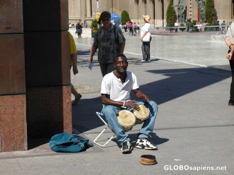 Postcard African musician in Plaza del Pilar