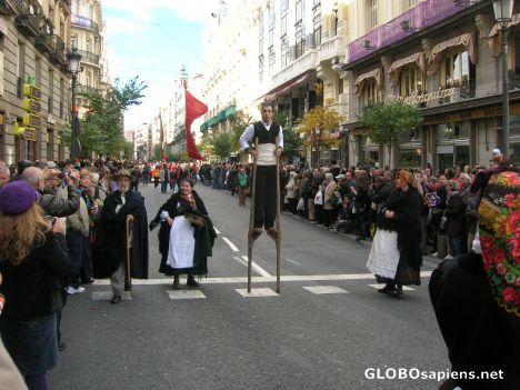 Postcard Man with stilts