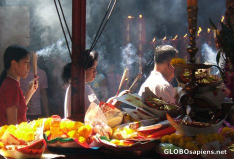 Postcard Thai devotees on their way to make offerings.