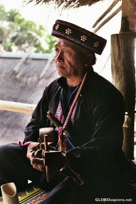 Postcard Akha Hill Tribe Man playing music...