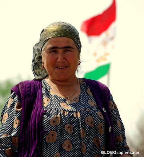 Postcard The woman and the Tajik flag