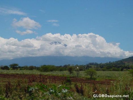 Postcard Mount Meru in clouds.