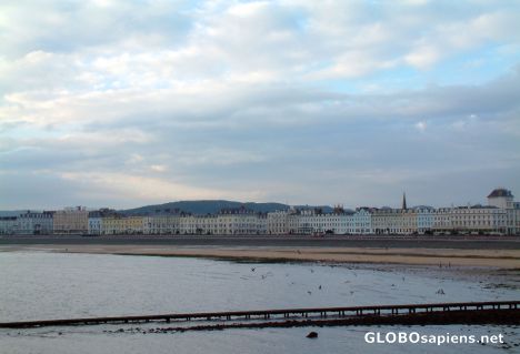 Postcard Llandudno - a line of houses at the beach