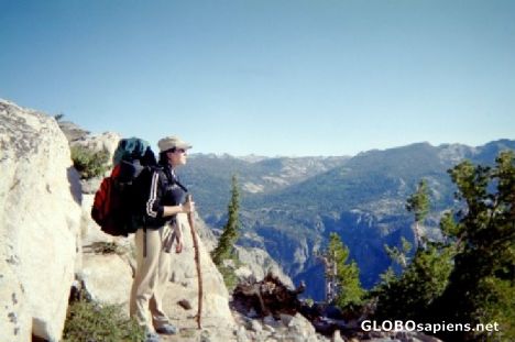 Postcard Backpacker looks out over vista