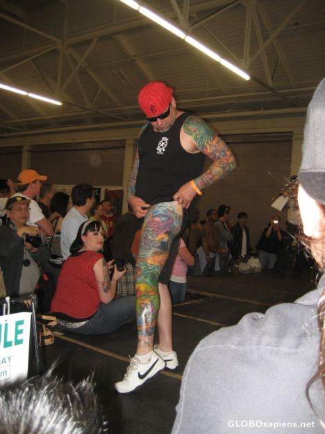 Postcard Winner of Best Male Leg delicately shows off