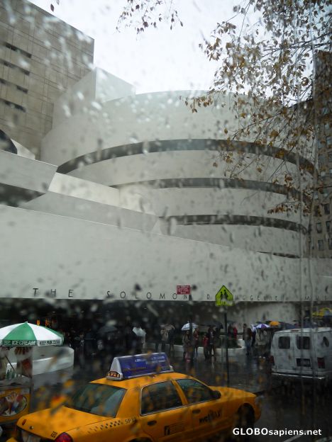 Postcard Driving through a rainy city -