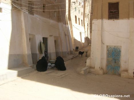 Postcard Women buying bread