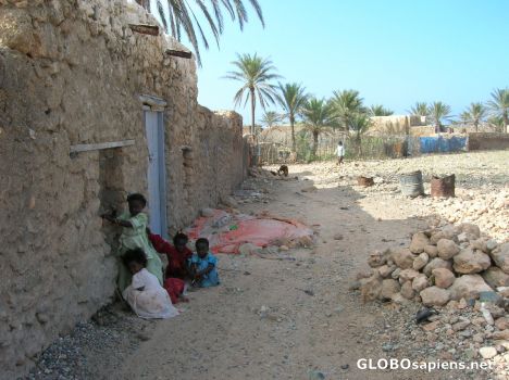 Postcard Children living in a poor environment