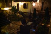 Patio of the Mangalemi (Tomi) Hotel at night, just after the rain.